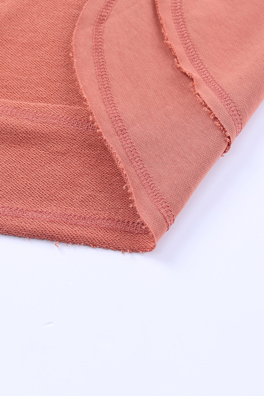 Salmon sweatshirt with asymmetric hemline detail and raw edge finish