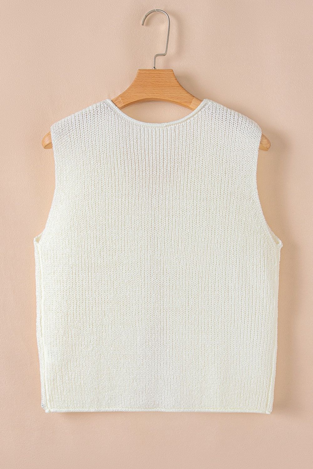 Beige textured knit tank top with crew neck and sleeveless design.