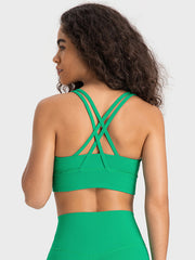 Green sports bra with crisscross back straps and wide band