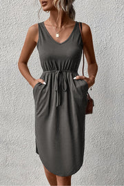 Dark gray sleeveless V-neck dress with drawstring waist and asymmetric hem
