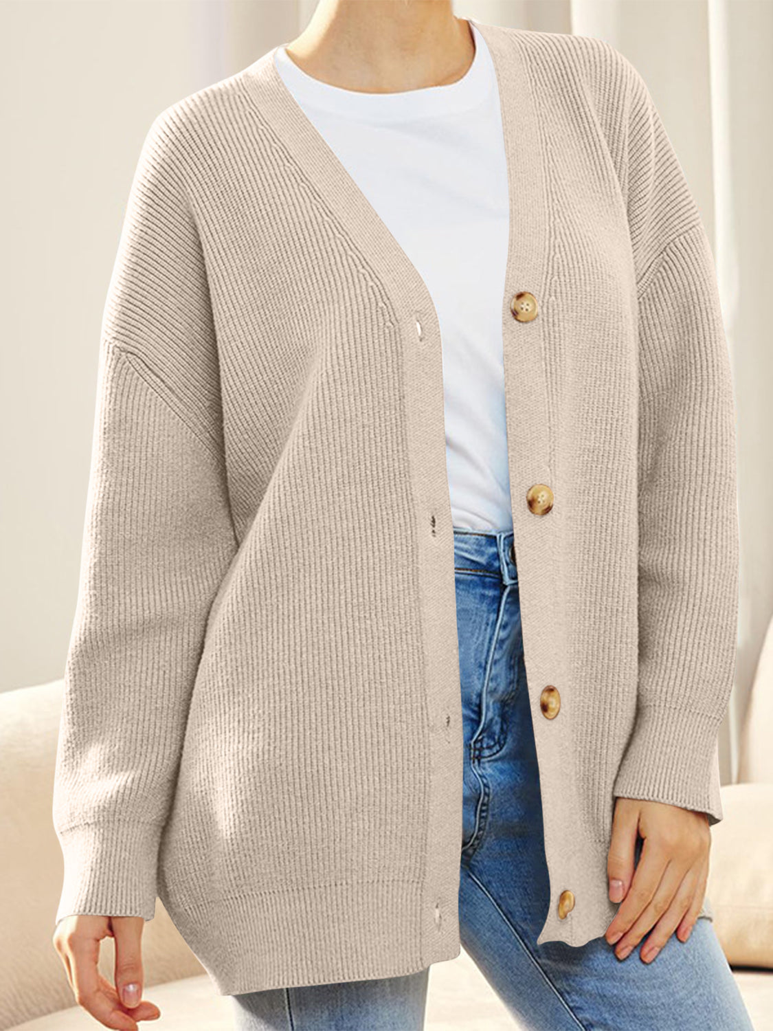 Dust Storm ribbed knit cardigan with balloon sleeves and button front, styled casually.