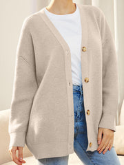 Dust Storm ribbed knit cardigan with balloon sleeves and button front, styled casually.