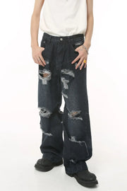 Distressed baggy dark denim jeans with statement rips and a comfortable cotton feel.