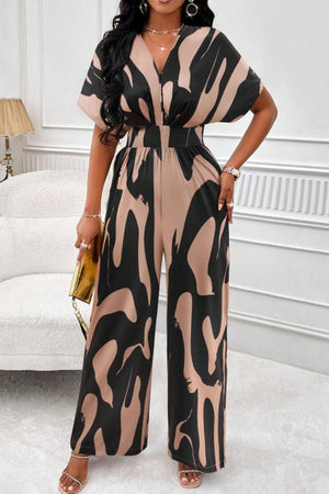 Abstract brushstroke wide-leg jumpsuit in black and taupe with short sleeves and a V-neck.