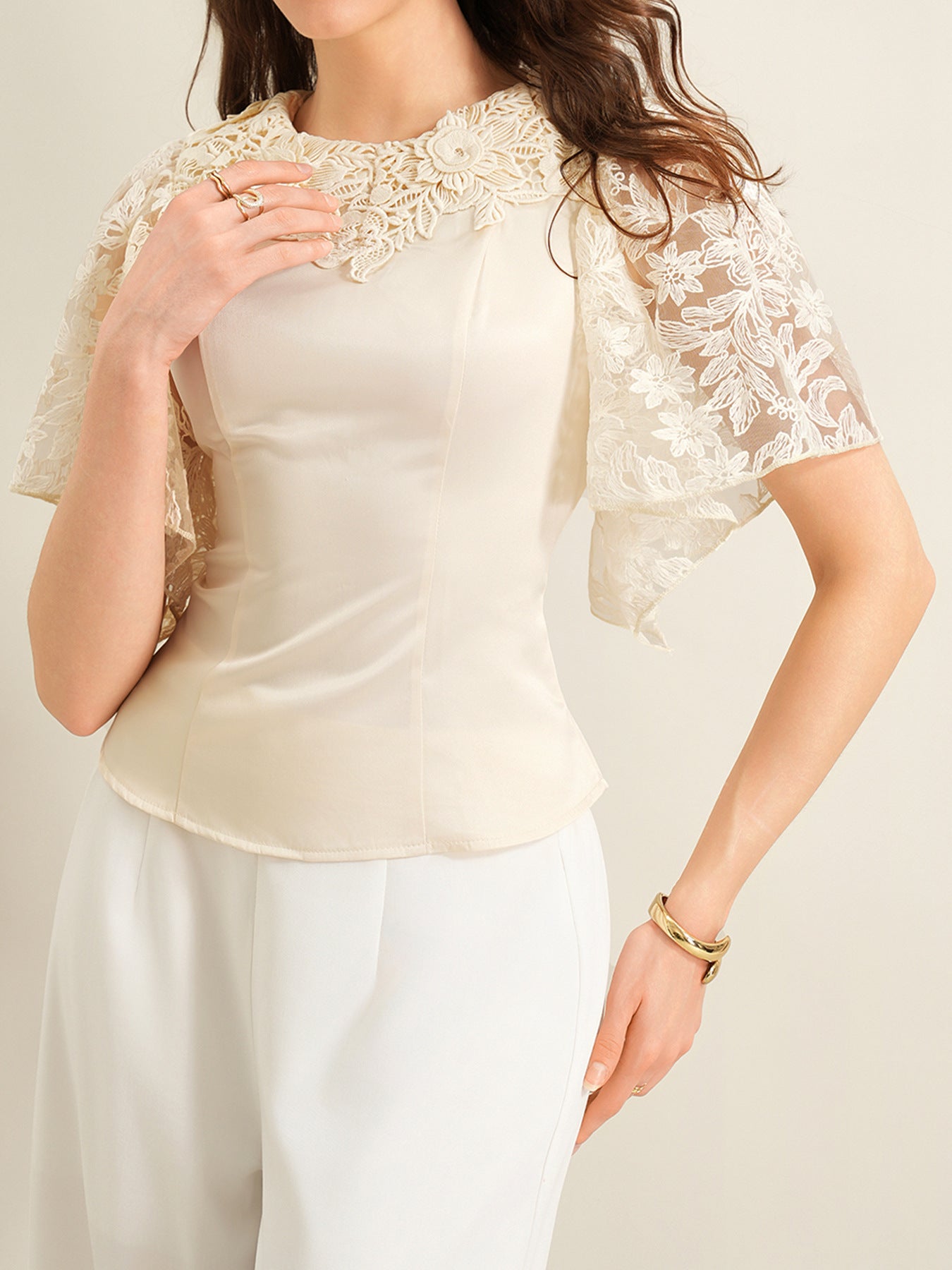 Apricot lace trimmed short-sleeve blouse with floral lace neckline and sleeves.