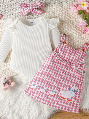 White ruffled long sleeve bodysuit with pink houndstooth duck dress and headband