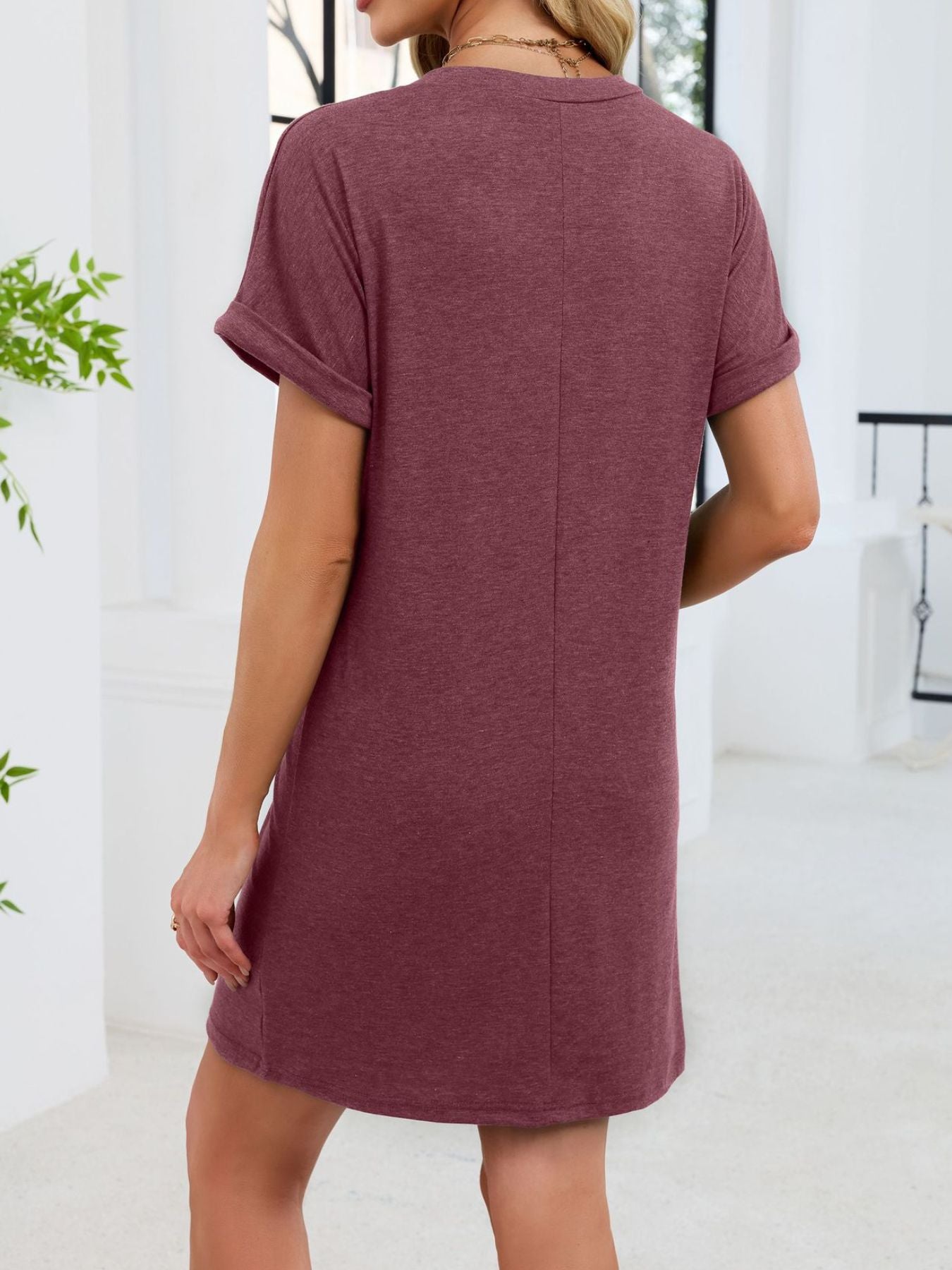 Wine red t-shirt dress with cuffed short sleeves and above-knee length.