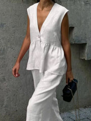 White sleeveless peplum top and wide-leg pants set, cotton blend, v-neck, casual women's outfit.