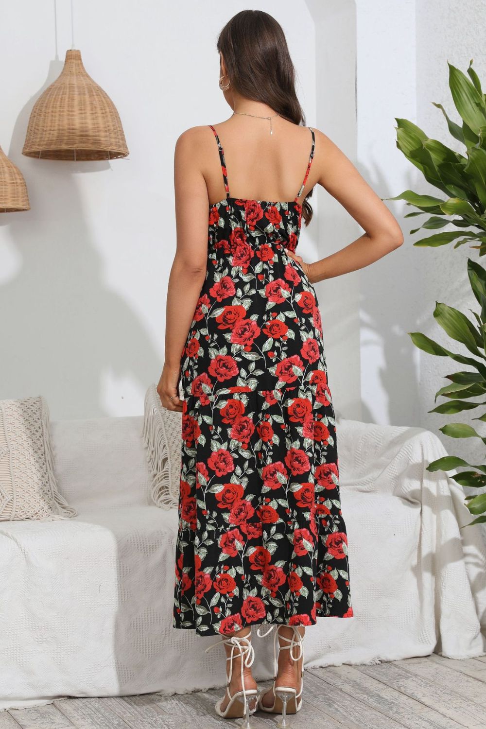 Floral print maxi dress with spaghetti straps and tiered skirt.