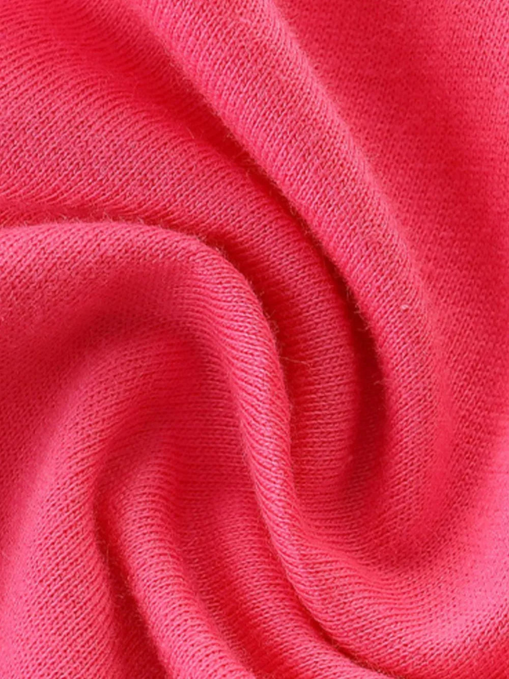Close-up of pink cotton knit fabric with soft texture