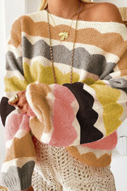 Scalloped stripe off-the-shoulder knit sweater in acrylic with a boat neckline and colorful wavy pattern.