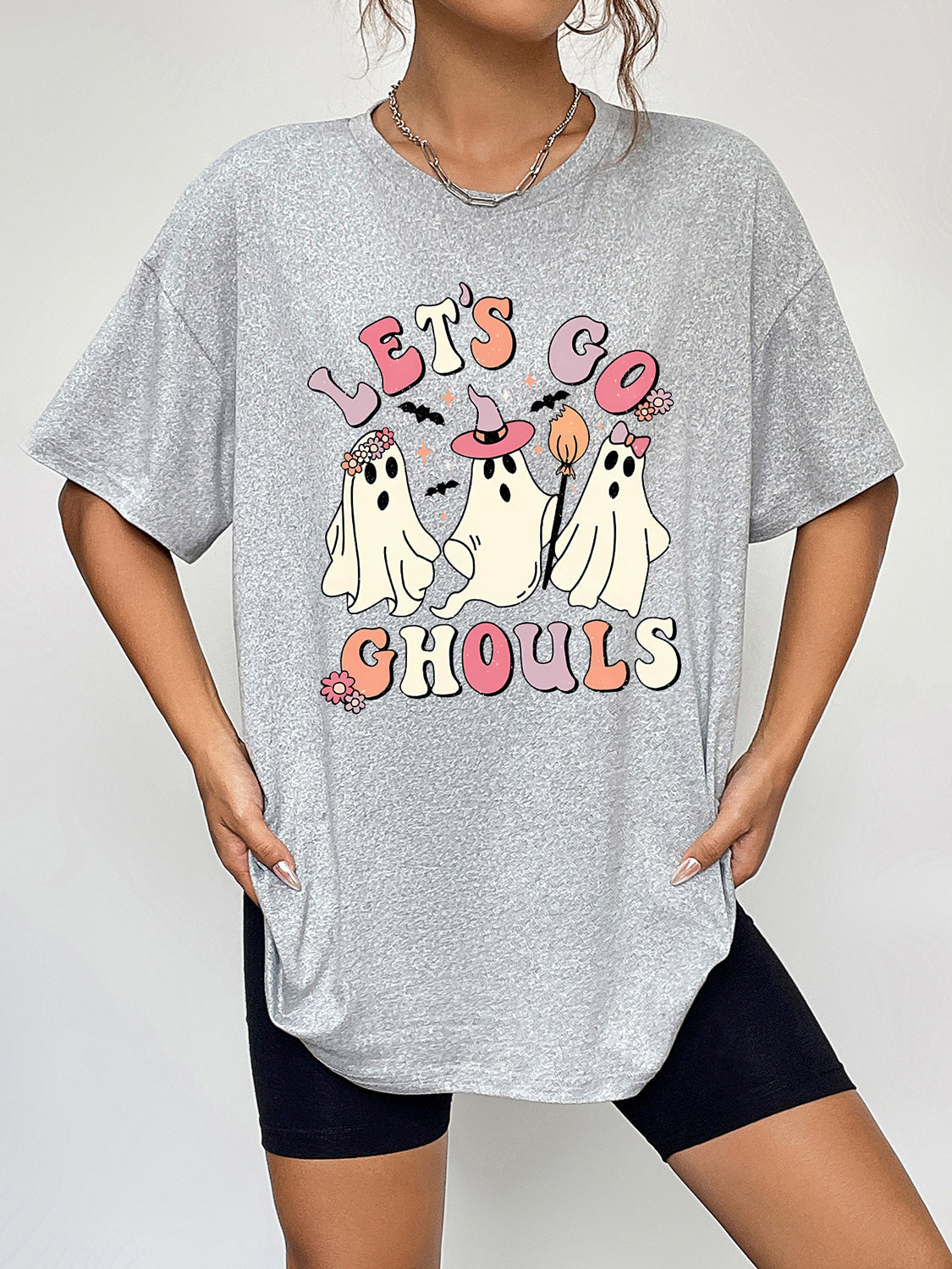 Grey graphic t-shirt with retro ghosts and "Let's Go Ghouls" text.