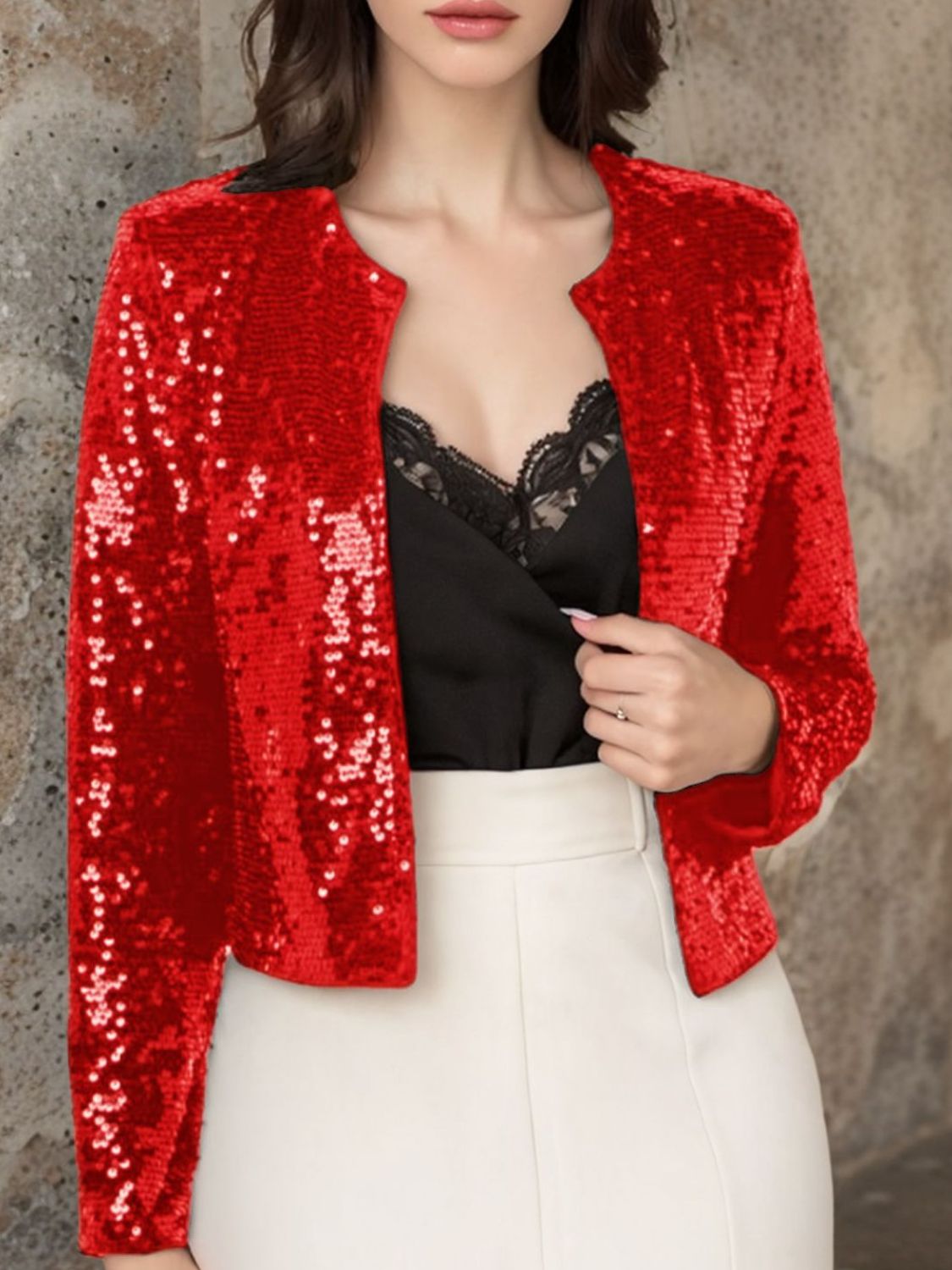 Scarlet sequin bolero jacket with open front and long sleeves.