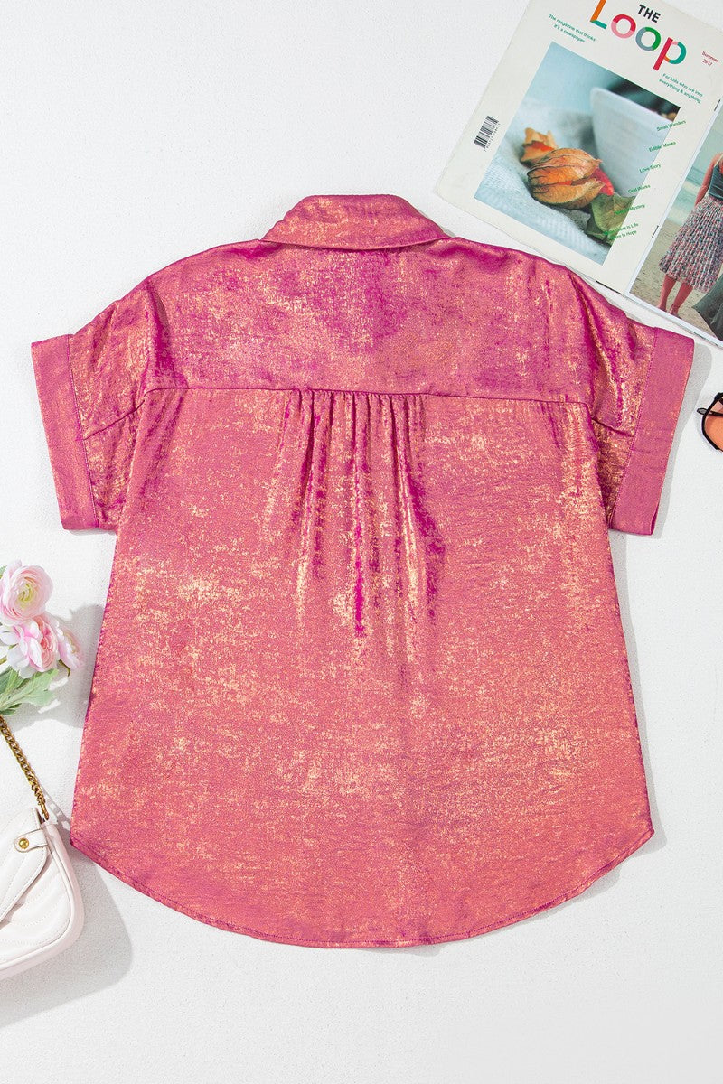 Dusty pink oversized button-down blouse with metallic finish and short sleeves.