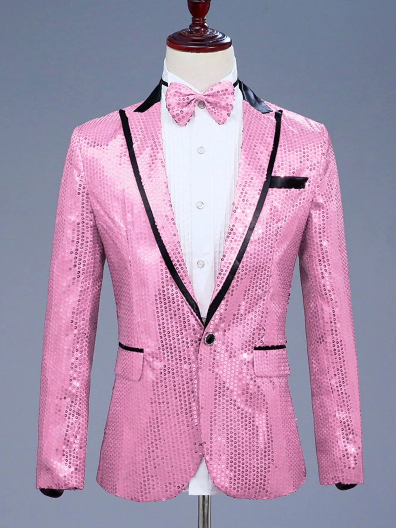 Pink sequin one button blazer with black lapel trim and matching bow tie.