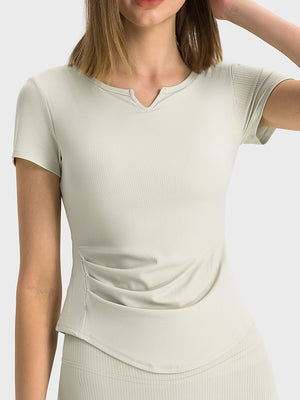 Ribbed notch-neck active t-shirt in light green with ruched side detail