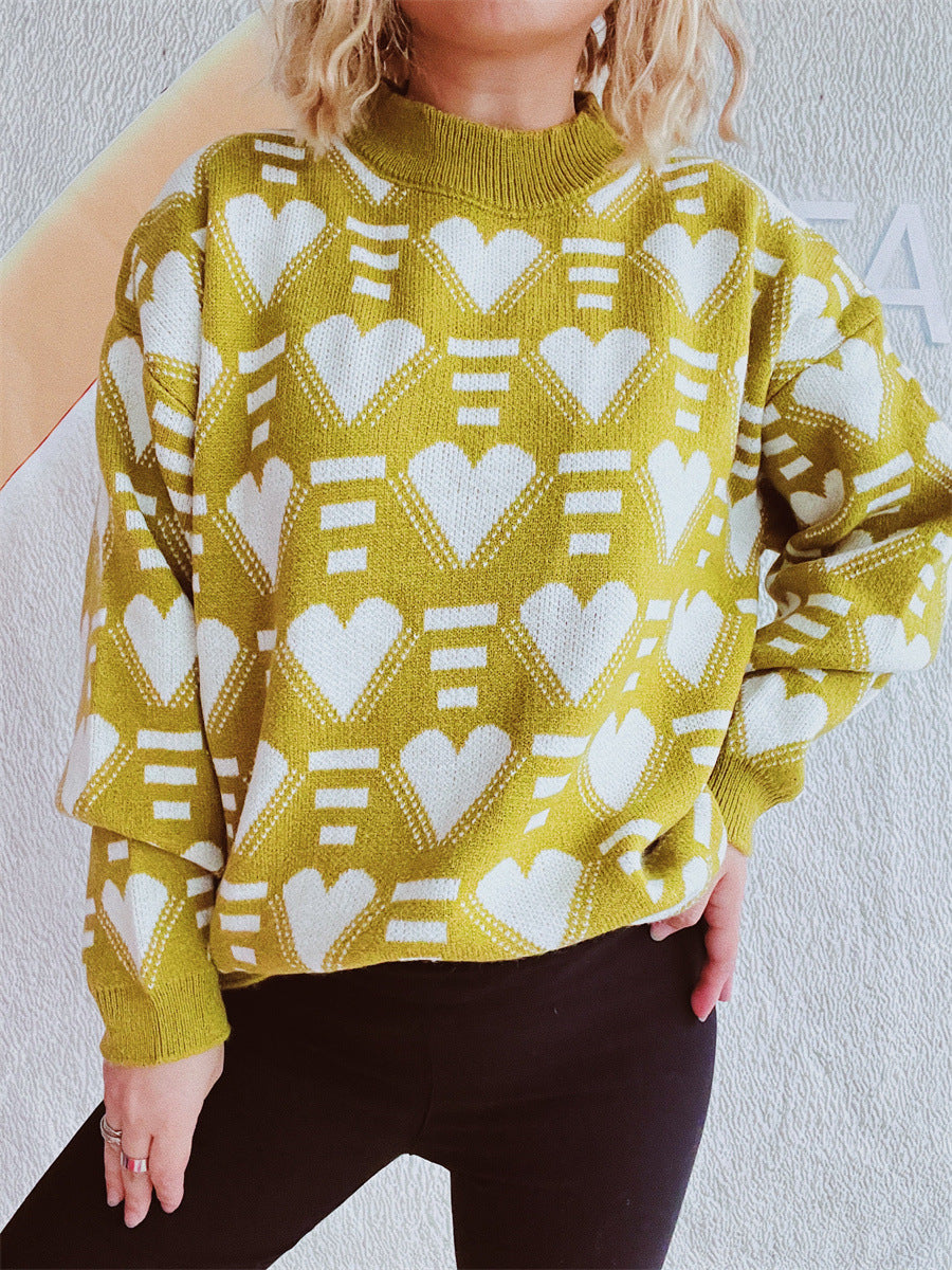 Mustard geometric heart jacquard knit jumper with mock neck and long sleeves.