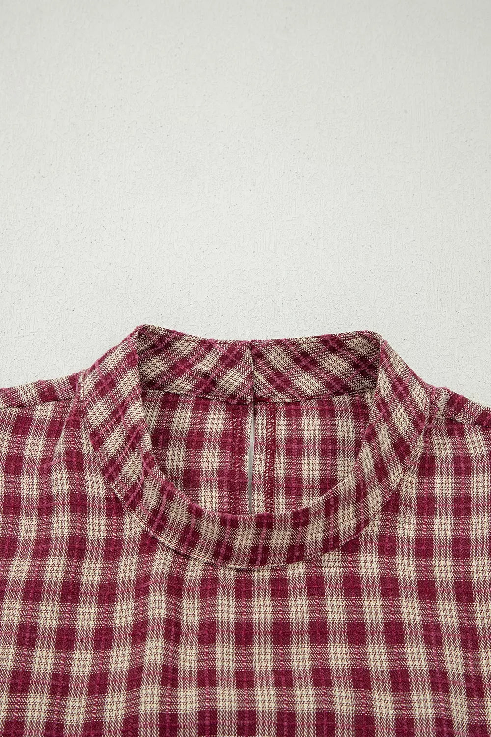 Country plaid long sleeve blouse in burgundy with button keyhole detail.