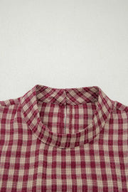 Country plaid long sleeve blouse in burgundy with button keyhole detail.