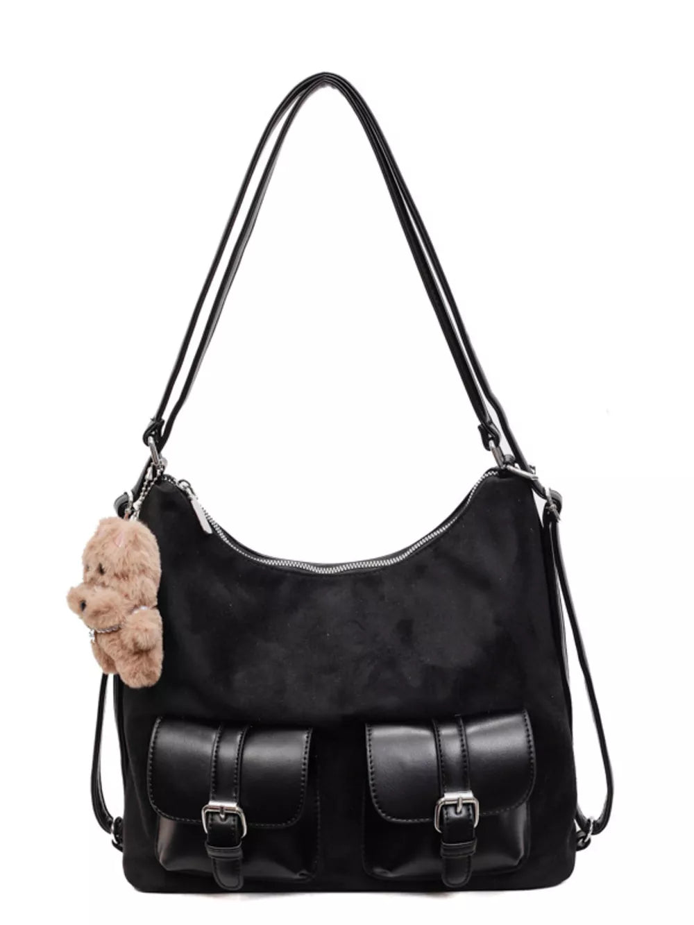 Black suede half-moon bag with two front buckle pockets and a fluffy charm.