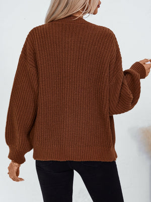 Brown ribbed knit button-up cardigan with balloon sleeves and a relaxed fit.