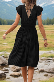 Black pleated flutter sleeve dress with smocked waist and tie back detail.