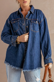 Dark blue denim oversized shirt jacket with frayed hem and button front.