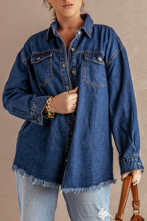 Dark blue denim oversized shirt jacket with frayed hem and button front.