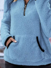 Blue fleece quarter zip pullover with black trim on pocket and collar.