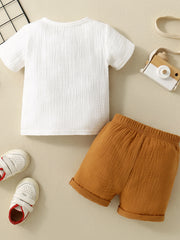 Children's white cotton gauze top and brown shorts set, casual comfortable outfit.