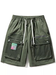Green multi-pocket cargo shorts with drawstring and zip pocket detail.