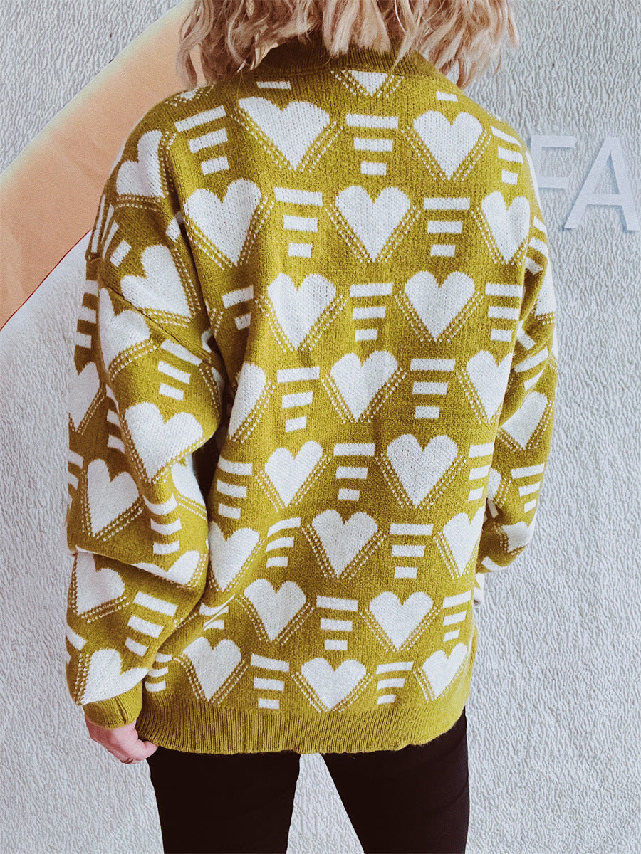 Mustard acrylic knit jumper with all-over white geometric heart pattern.