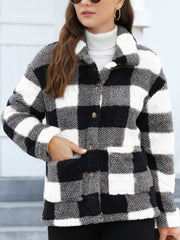 Plaid sherpa overshirt jacket in black and white with button front and pockets.
