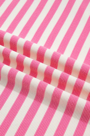 Polyester short sleeve tee with vibrant pink and white stripes and a textured knit.