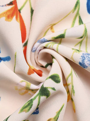 Cream A-line maxi dress fabric with a colorful wildflower print and square neckline detail.