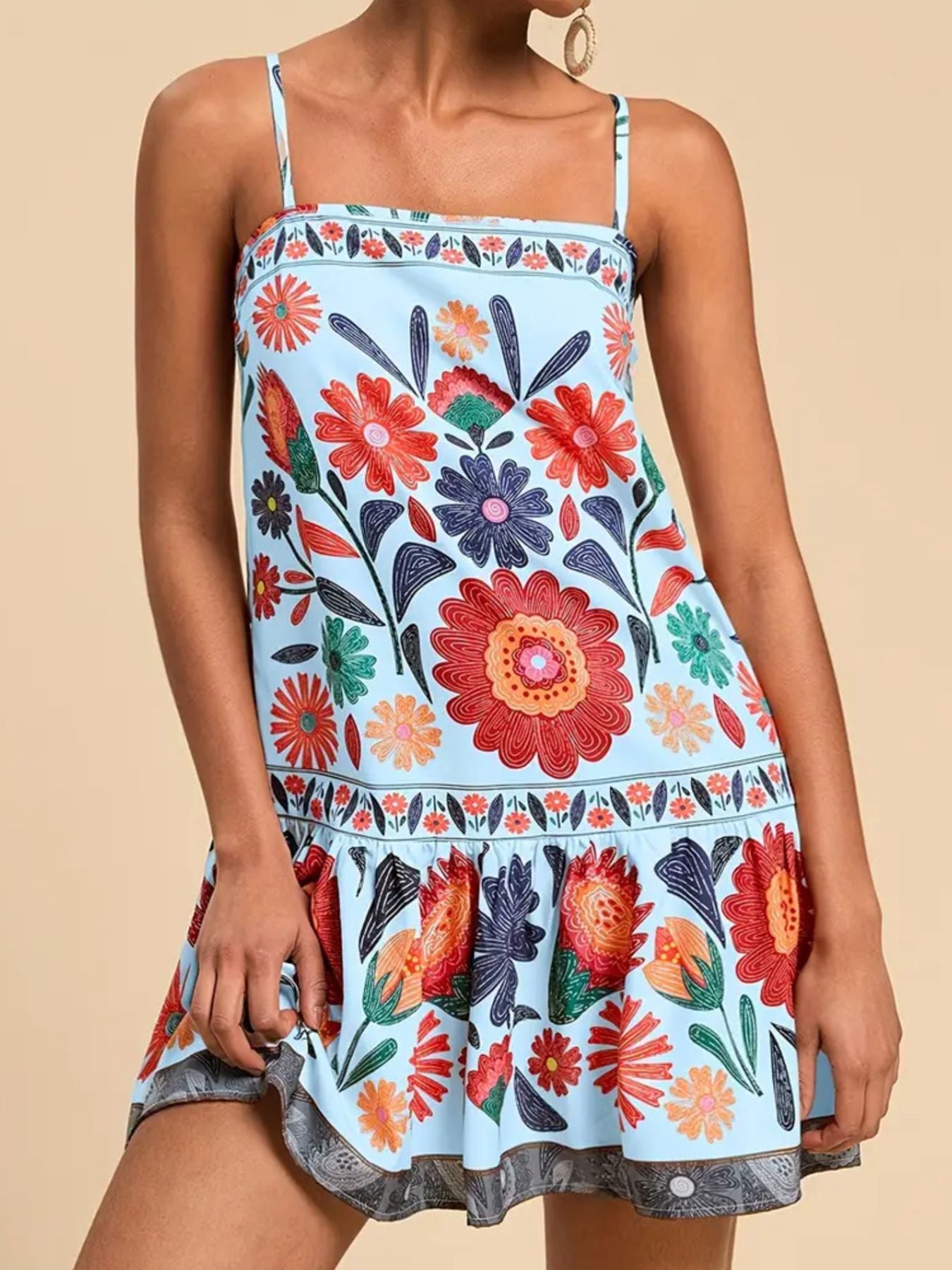 Light blue mini dress with vibrant floral print, square neckline, and ruffled hem.