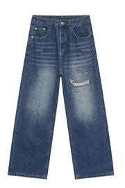 Baggy patchwork denim jeans in medium vintage wash with distressed details.