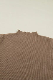 Brown ribbed knit mock neck sweater vest with lettuce edge detail.