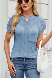 Sky blue knit top with textured checkered pattern and chest pocket.