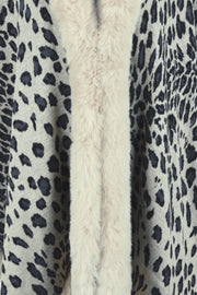 Leopard print cape with cream faux fur trim detail