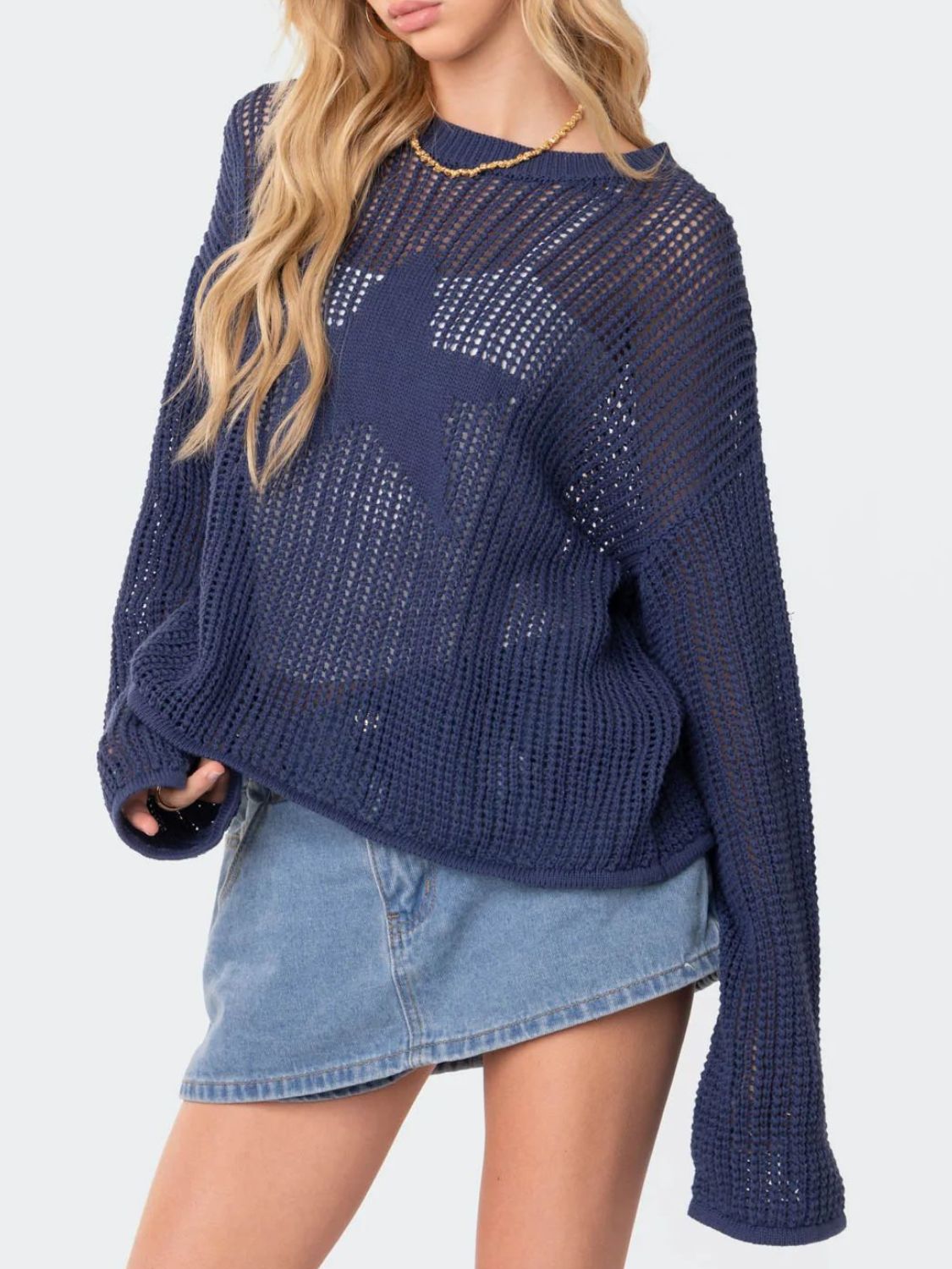 Dusty blue open knit sweater with a starburst pattern, crew neck, and long sleeves.
