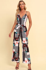 Geometric print cami jumpsuit with tie waist and wide legs.