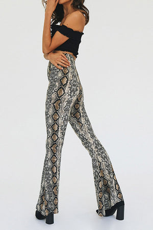 Serpentine bell-bottom pants in snakeskin print with a second-skin fit.