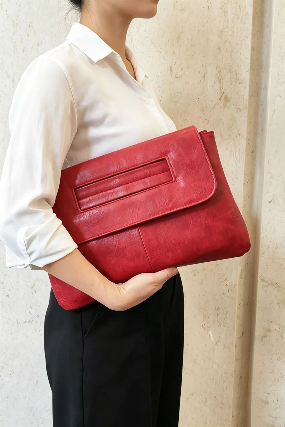 Red distressed leather envelope clutch with cut-out handle detail