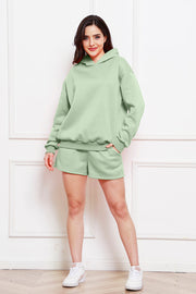 Sage oversized hoodie and bermuda shorts set with a relaxed fit.