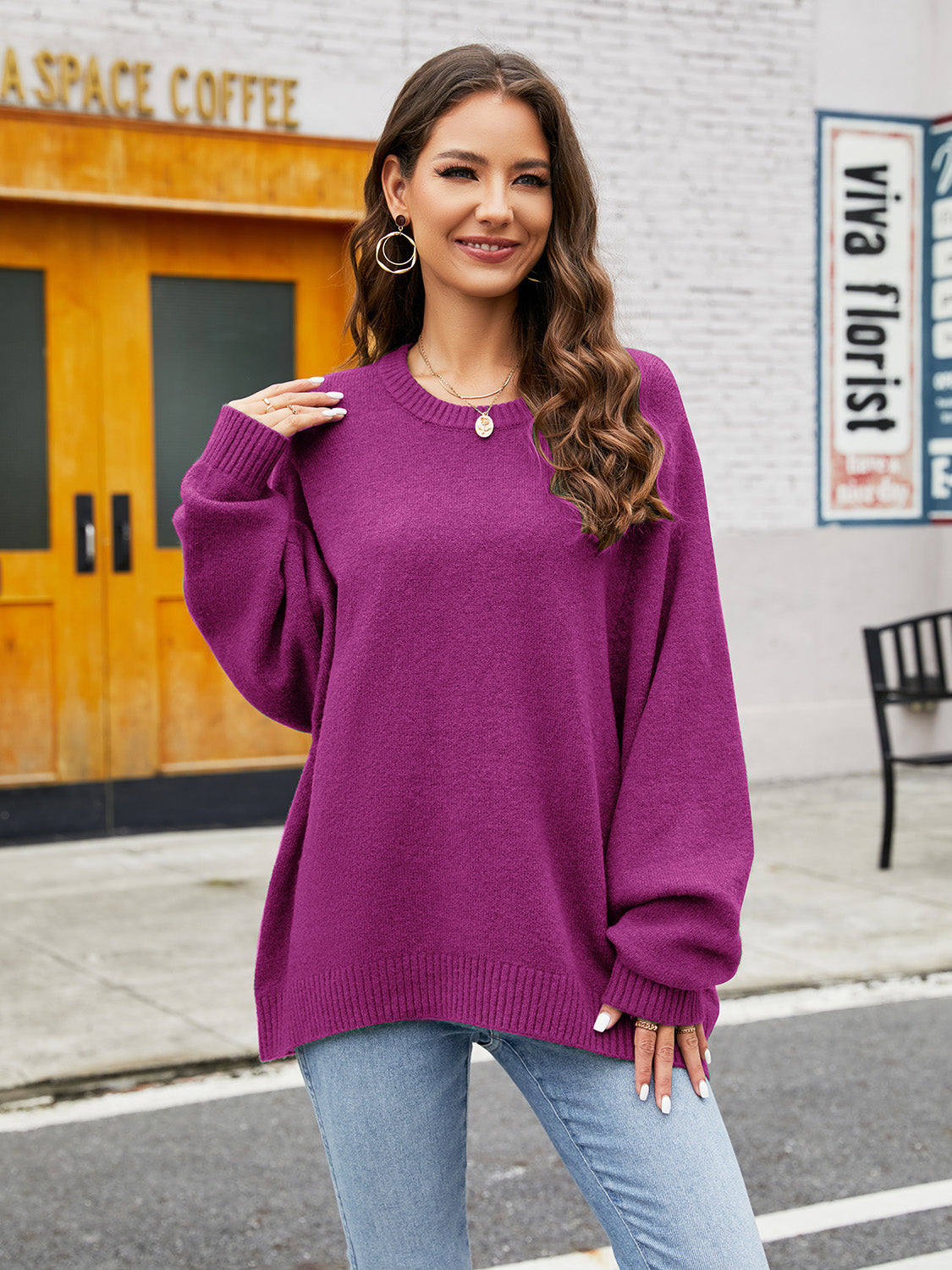 Fuchsia acrylic crewneck sweater with balloon sleeves and ribbed trim.