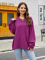 Fuchsia acrylic crewneck sweater with balloon sleeves and ribbed trim.