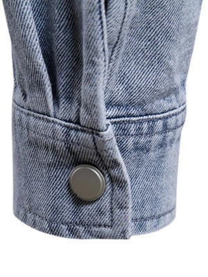 Faded denim utility shirt jacket cuff with button detail, light wash.