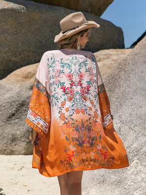 Ombre floral kimono cover-up in orange viscose with wide sleeves and a boho print.