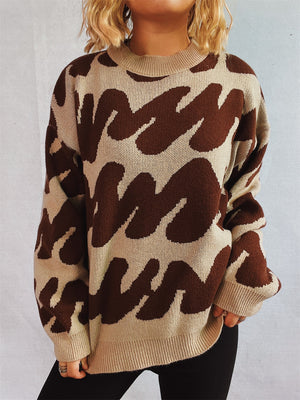 Graphic wave knit sweater in brown and camel with crew neck and long sleeves.
